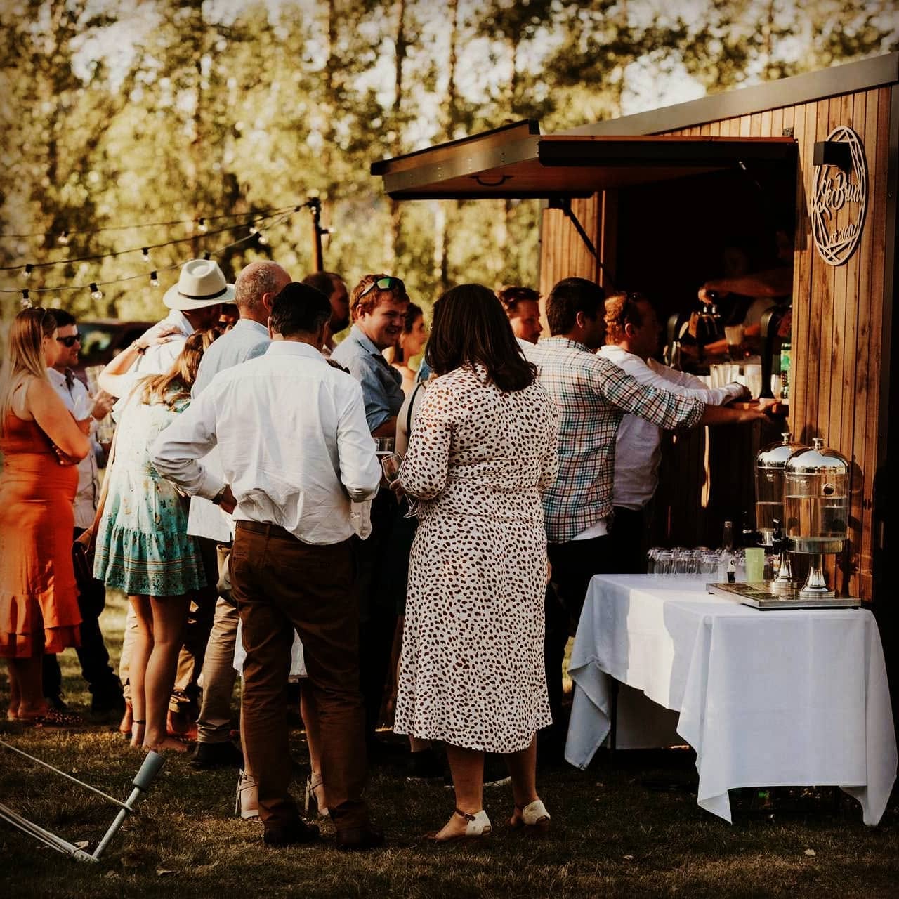 Guests at the open hatch of The Tow Bar